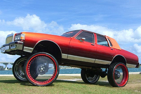 i could be wrong here, but sick rims might just be the answer.